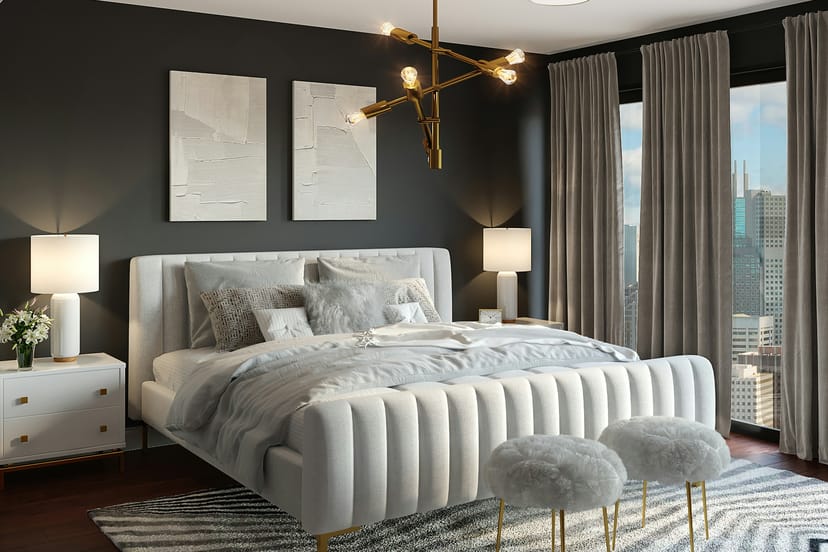 Chambre élégante, tête de lit capitonnée et rideaux sombres